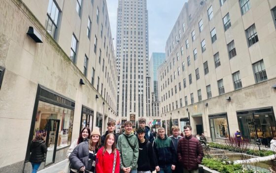 Selby College Art students posing for a photo in front of the famous Rockefeller Building